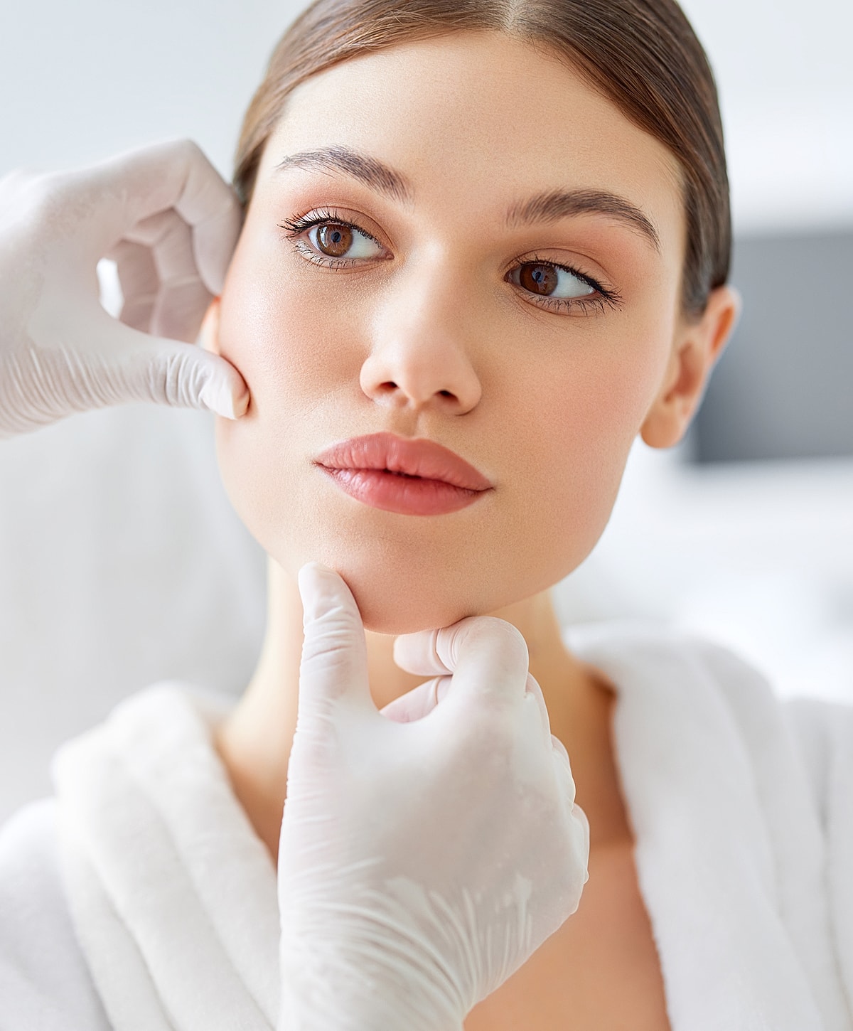 Skincare treatment on a woman's face.
