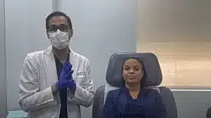 Doctor and patient in a medical setting.