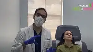 Medical professional consulting with a patient.