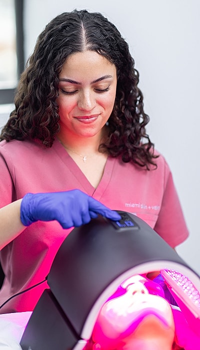 Skin treatment session with LED lighting.