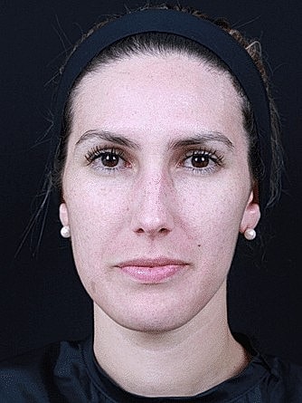 Portrait of a woman with a neutral expression.