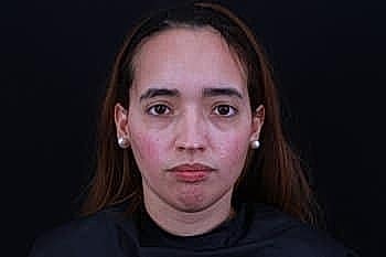 Portrait of a woman with neutral expression.