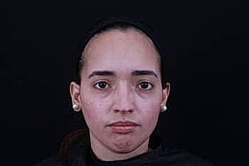 Portrait of a woman with neutral expression.