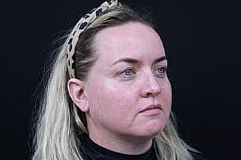 Woman with blonde hair and a headband.