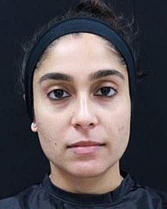 Portrait of a woman with dark hairband.