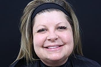 Woman smiling with makeup ready for photography