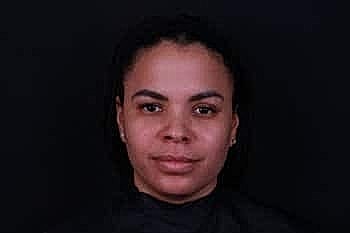 Portrait of a woman with dark hair.