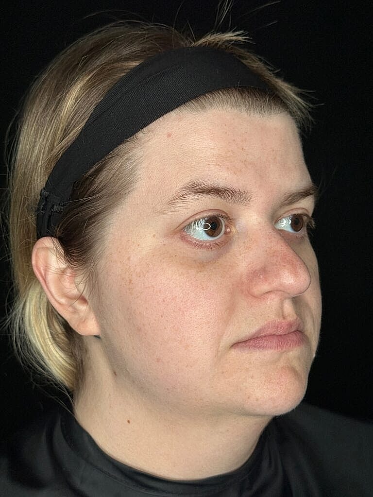 Person with headband looking off to the side.