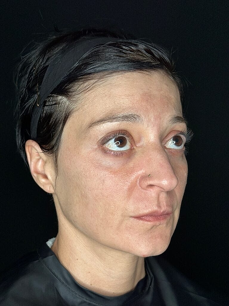 Woman with dark hair, close-up portrait.