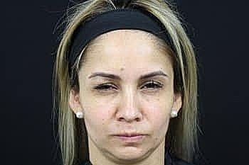 Headshot of a woman with neutral expression.