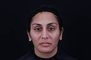 Close-up portrait of a serious woman.