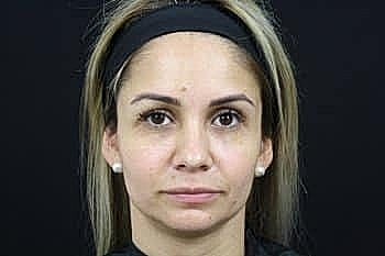 Headshot of a woman with a neutral expression.