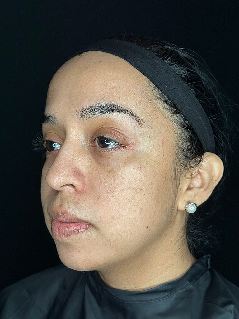 Profile of a woman with natural makeup.