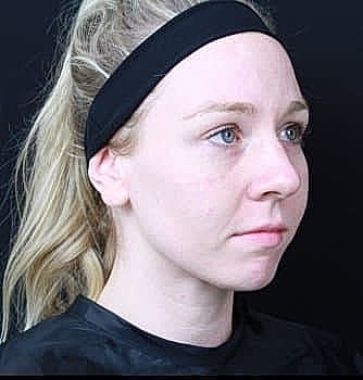 Woman with blonde hair and black headband.