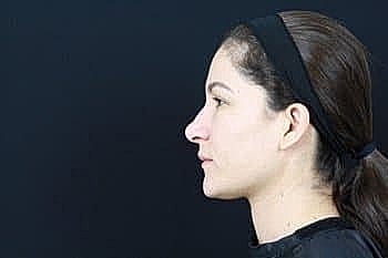 Profile view of a woman with headband