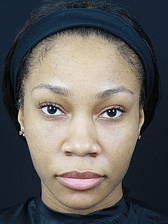 Woman with natural makeup and headband.