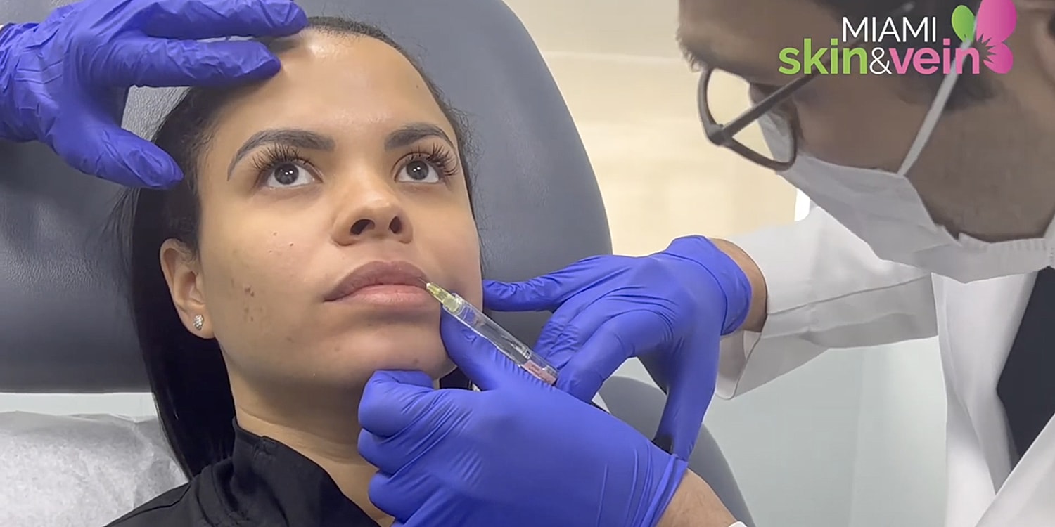 Facial treatment session in progress with device.
