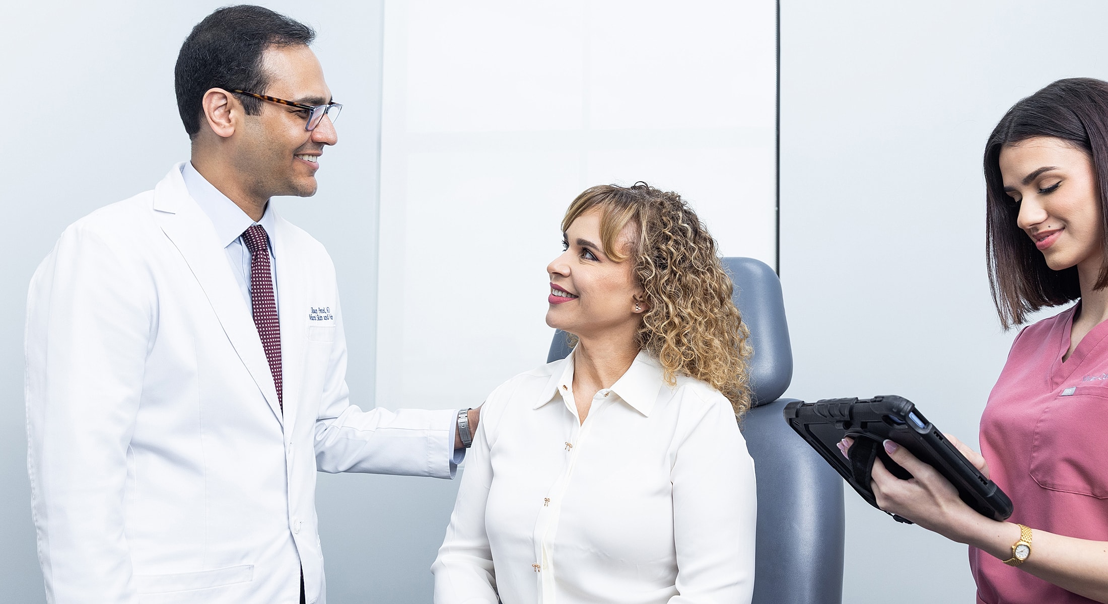 Doctor consulting with patient in medical office.