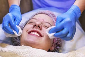 happy girl teenager on the procedure at the beautician, cleaning